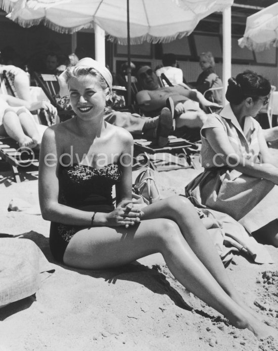 Grace Kelly on the beach in Cannes during the shooting of "To Catch a Thief". Cannes 1954. - Photo by Edward Quinn