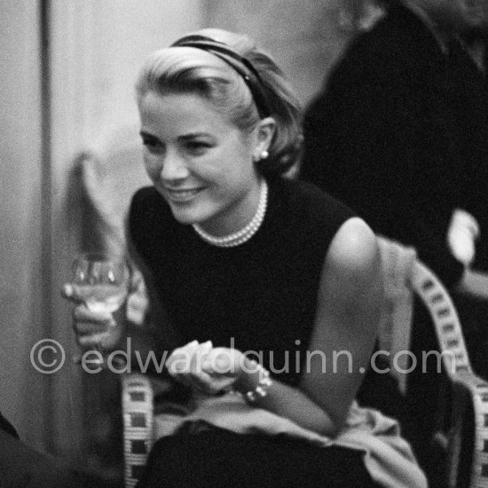 Grace Kelly during a press cocktail party at the Carlton Hotel, where she charmed everybody by trying out her French and emphasizing her words with gestures and expressions. Cannes 1954. - Photo by Edward Quinn