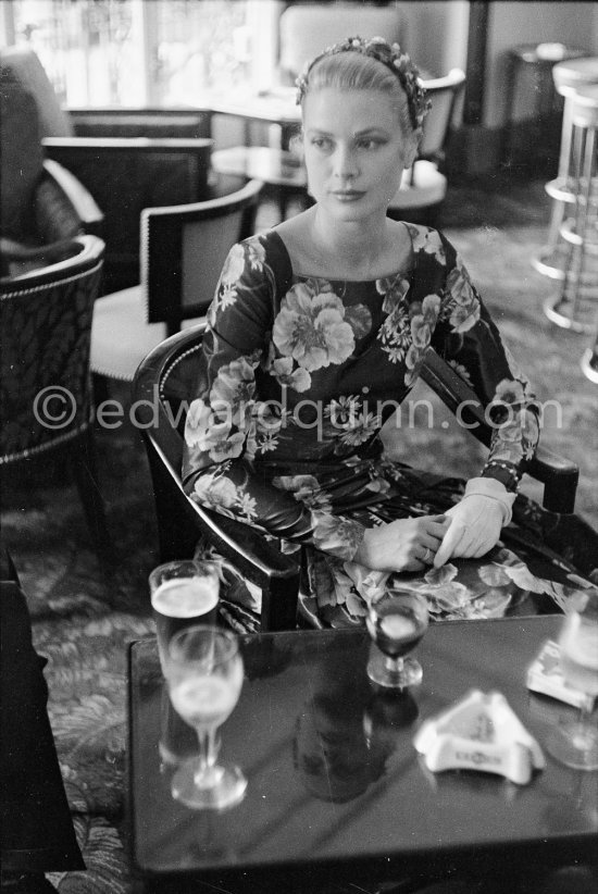 Grace Kelly (later to become Princess Grace) arriving a little early for her audience with Prince Rainier in Monte Carlo in 1955. As a routine part of her job, she went over to Monaco with the MGM representative to have pictures taken for a pubIicity spread in Paris-Match. She hadn’t had lunch, and appreciated time for a sandwich at the Hotel de Paris. - Photo by Edward Quinn