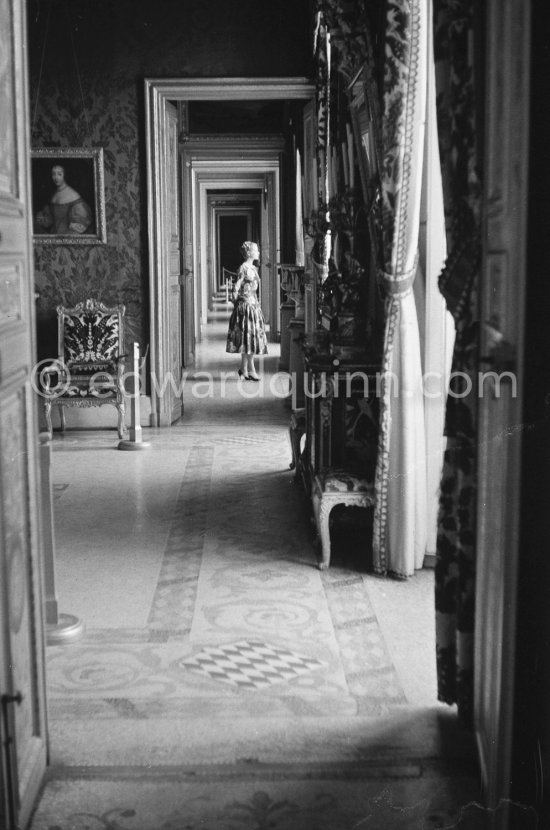 Grace Kelly (later to become Princess Grace) at the Royal Palace just before she met Prince Rainier for the first time. One of Prince Rainier’s personal servants, Michel Demorizi, guided her around some of the great number of rooms of the Royal Palace. Monaco 1955. - Photo by Edward Quinn