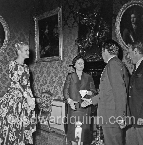 Prince Rainier III of Monaco meeting American film Star Grace Kelly (later to become Princess Grace) for the first time at his Monaco Palace in 1955. Here he greets her friend Gladys de Ségonzac, costume designer. - Photo by Edward Quinn