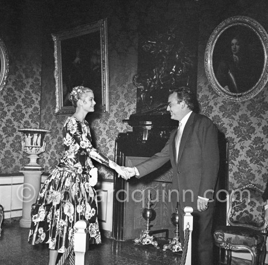 Grace Kelly Grace Kelly (later to become Princess Grace) meets Prince Rainier at the Royal Palace. The historic moment of the first formal handshake. Their smile seems to show an instant contact and already a mutual esteem. Monaco 1955. - Photo by Edward Quinn