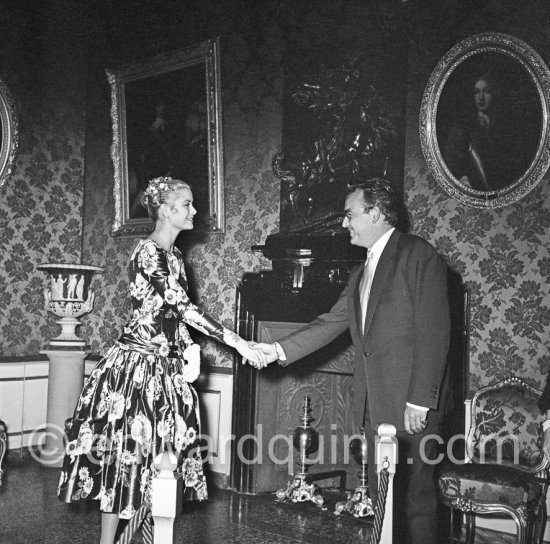 Grace Kelly Grace Kelly (later to become Princess Grace) meets Prince Rainier at the Royal Palace. The historic moment of the first formal handshake. Their smile seems to show an instant contact and already a mutual esteem. Monaco 1955. - Photo by Edward Quinn