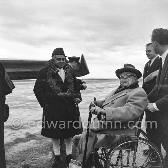 Prince Aga Khan at Nice Airport to welcome a guest. With him is his son Prince Aly Khan (right). Nice Airport 1953. - Photo by Edward Quinn