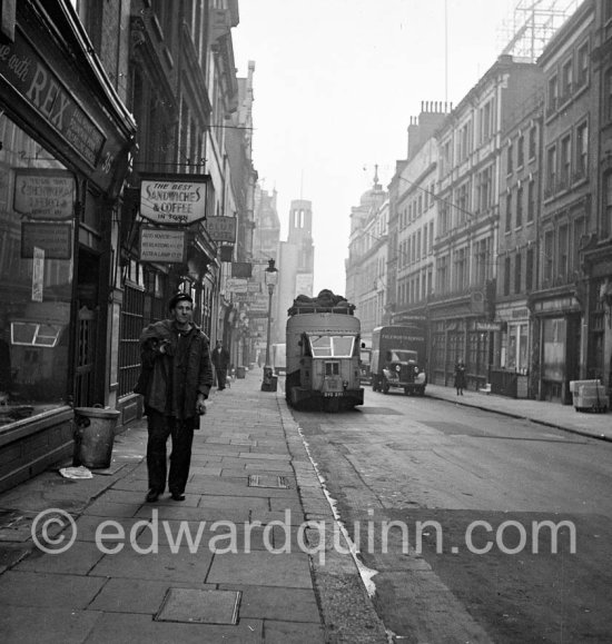 Dustmen. Outside the Blue Posts pub, Rupert Street, looking south towards Coventry Street. London 1950. - Photo by Edward Quinn