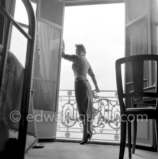 A privileged view: Sophia Loren looking out at the sea from her room in the Carlton Hotel. Cannes Film Festival 1955. - Photo by Edward Quinn