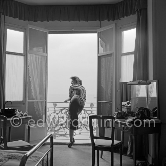 A privileged view: Sophia Loren looking out at the sea from her room in the Carlton Hotel. Cannes Film Festival 1955. - Photo by Edward Quinn