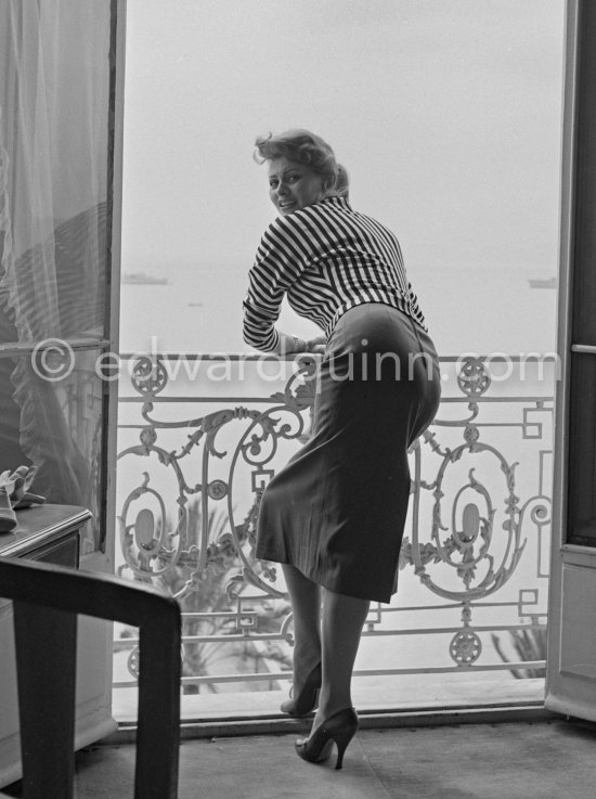 A privileged view: Sophia Loren looking out at the sea from her room in the Carlton Hotel. Cannes Film Festival 1955. - Photo by Edward Quinn