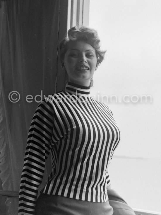 A privileged view: Sophia Loren looking out at the sea from her room in the Carlton Hotel. Cannes Film Festival 1955. - Photo by Edward Quinn