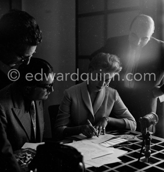 Sophia Loren signing photos. Carlton Hotel, Cannes 1955. - Photo by Edward Quinn