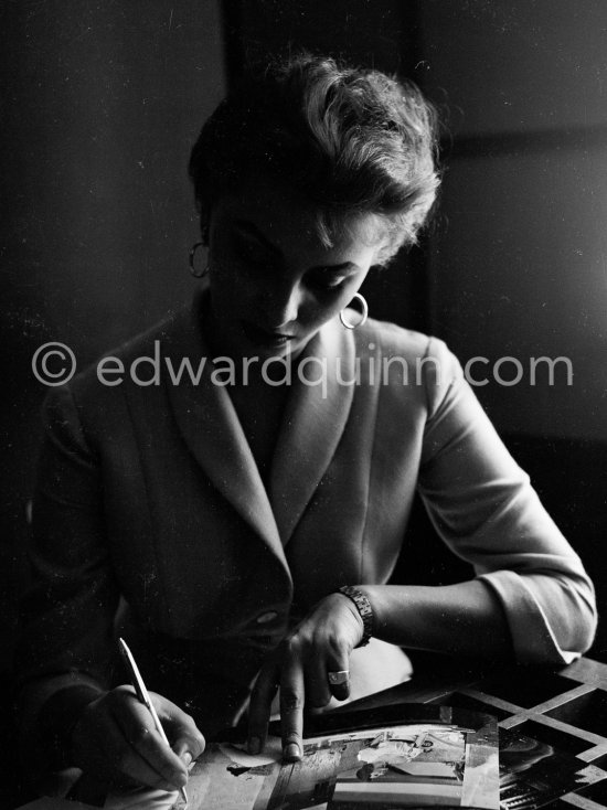 Sophia Loren signing photos. Carlton Hotel, Cannes 1955. - Photo by Edward Quinn