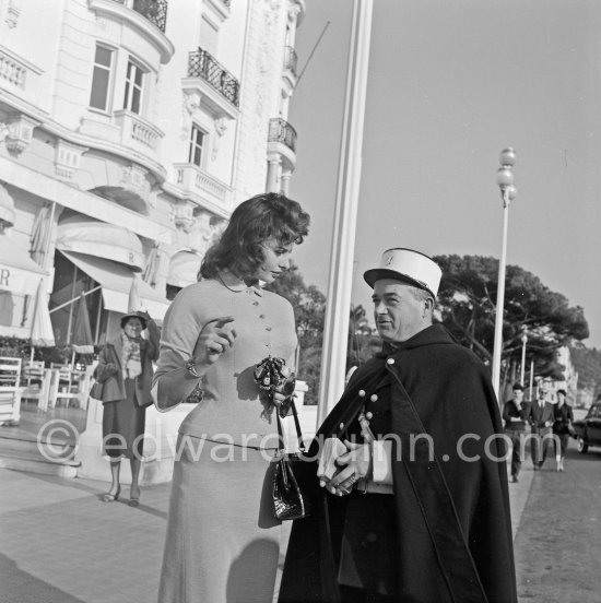 The Police of Nice is interested in Sophia Loren. Promenade des Anglais, in front of Hotel Negresco, Nice 1957. - Photo by Edward Quinn