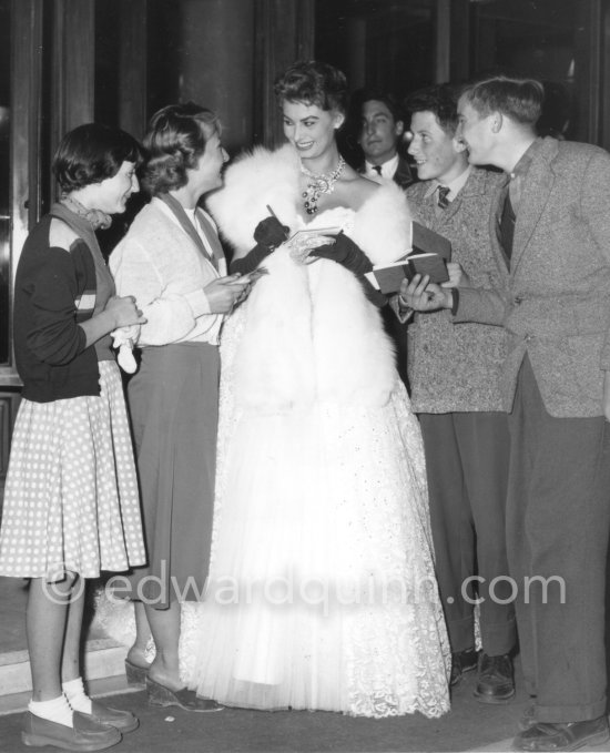 Sophia Loren, stopped by fans at the entrance to the Carlton Hotel, where her film "The Gold of Naples" was shown in 1955. - Photo by Edward Quinn