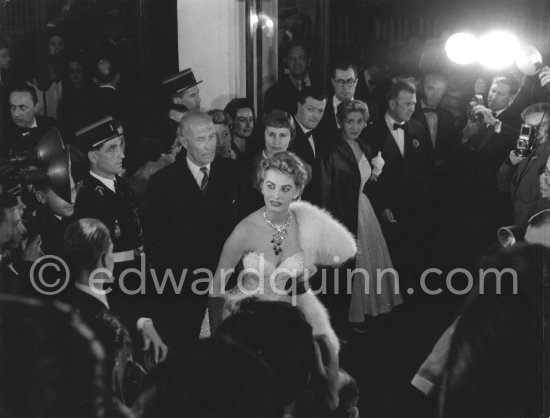 Sophia Loren, wearing an evening gown designed by Emilio Schuberth, making her entry to the Palais du Festival Cannes 27 April 1955. - Photo by Edward Quinn