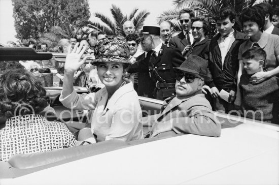 Sophia Loren and husband Carlo Ponti. Nice Airport 1961. Car: Ford Thunderbird 1961 Convertible. - Photo by Edward Quinn