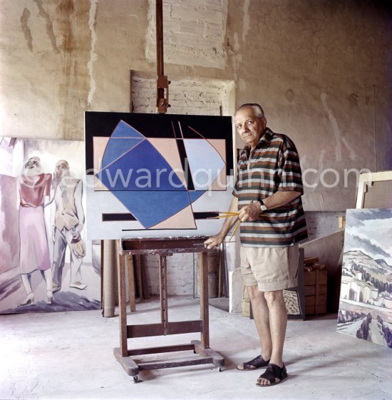 Alberto Magnelli viewing catalogue of his exibition at Galerie de France, Paris, 1960, at his studio La Ferrage, Plan-de-Grasse 1957. - Photo by Edward Quinn