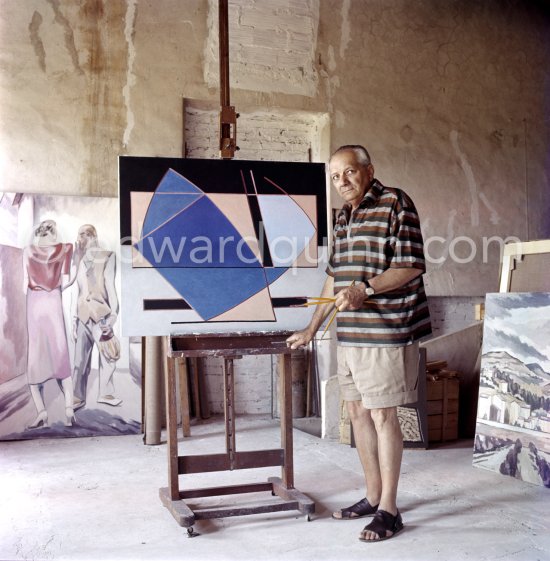 Alberto Magnelli viewing catalogue of his exibition at Galerie de France, Paris, 1960, at his studio La Ferrage, Plan-de-Grasse 1957. - Photo by Edward Quinn