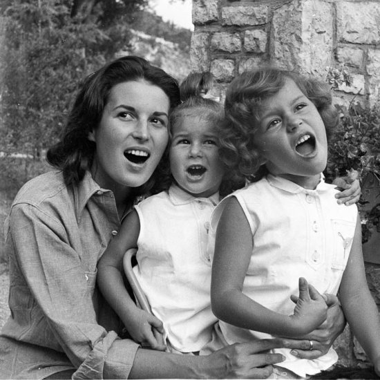 Silvana Mangano singing with her daughters Veronica (left) and Rafaela in the gardens of her villa, 1955. She was married to the film producer Dino De Laurentiis. - Photo by Edward Quinn