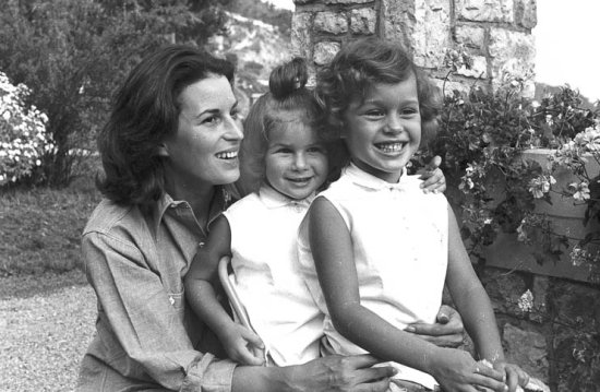 Silvana Mangano playing with her daughters Veronica (left) and Rafaela in the gardens of her villa, 1955. She was married to the film producer Dino De Laurentiis. - Photo by Edward Quinn