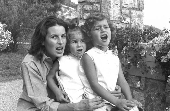 Silvana Mangano singing with her daughters Veronica (left) and Rafaela in the gardens of her villa, Roquebrune-Cap Martin 1955. She was married to the film producer Dino De Laurentiis. - Photo by Edward Quinn