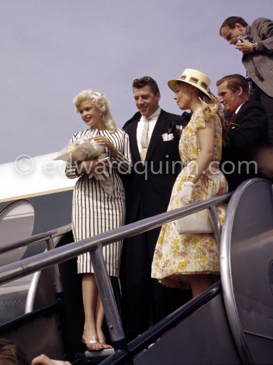 When Jayne Mansfield came to the Cannes Film Festival in 1958, she had just married Mickey Hargitay, the ex-muscle man in Mae West’s nightclub act and former Mr. Universe. From the moment of her arrival at Nice Airport, Jayne had to fight her way through a crowd of fans and journalists. Nice Airport 1958. - Photo by Edward Quinn