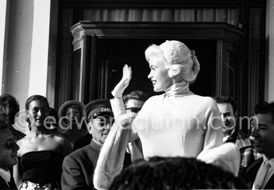 Jayne Mansfield and her husband Mickey Hargitay (right) in front of Carlton Hotel. Cannes Film Festival 1958. - Photo by Edward Quinn