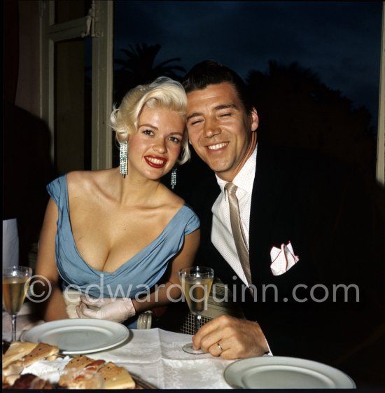 Jayne Mansfield, the bosomy blonde actress who loved to make the headlines, at the Cannes Film Festival in 1958 with her new husband, Mickey Hargitay, the ex-muscleman from Mae West’s nightclub. Cannes 1958. - Photo by Edward Quinn