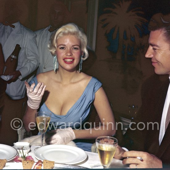 Jayne Mansfield, the bosomy blonde actress who loved to make the headlines, at the Cannes Film Festival in 1958 with her new husband, Mickey Hargitay, the ex-muscleman from Mae West’s nightclub. Cannes 1958. - Photo by Edward Quinn