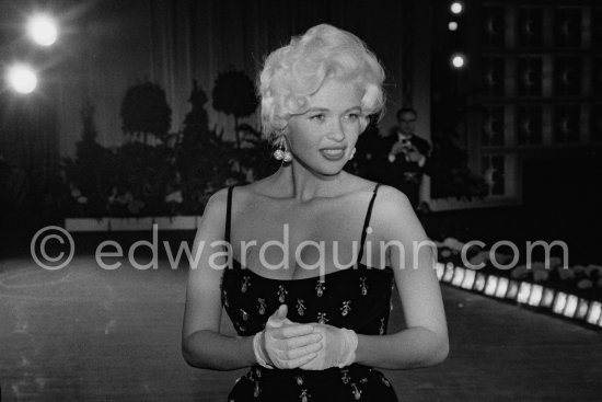 Jayne Mansfield, the bosomy blonde actress who loved to make the headlines, at the Cannes Film Festival in 1958 with her new husband, Mickey Hargitay, the ex-muscleman from Mae West’s nightclub. Cannes 1958. - Photo by Edward Quinn