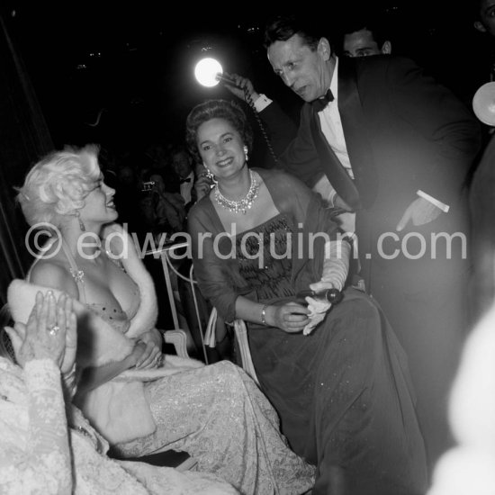Jayne Mansfied, the Begum and the Cannes Festival organiser Robert Favre Le Bret. Cannes 1958. Composed of spectacular cushion, brilliant, and banquette shaped diamonds, this modern Diamond Fringe Necklace was likely created by Harry Winston and acquired by the Aga Khan at some point in the early 1950s. . - Photo by Edward Quinn