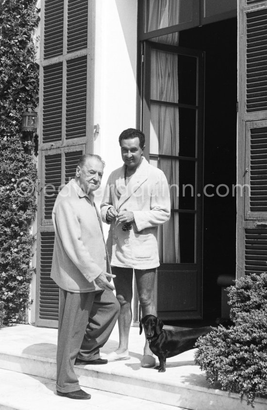 The Grand Old Man of storytelling Somerset Maugham with his secretary and companion Alan Searle and his Dachshund George. Villa Mauresque, Saint-Jean-Cap-Ferrat 1960. - Photo by Edward Quinn