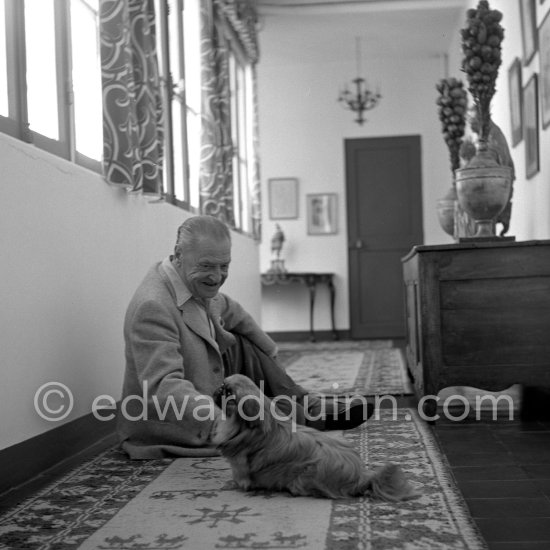 W. Somerset Maugham plays with Chin, one of his two Pekingese, at his Villa Mauresque. Saint-Jean-Cap-Ferrat 1954. - Photo by Edward Quinn