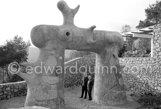 Joan Miró and Aimé Maeght in the gardens of Musée Maeght with the sculpture "L'Arc" ("The Arch"), Saint-Paul-de-Vence 1964. - Photo by Edward Quinn