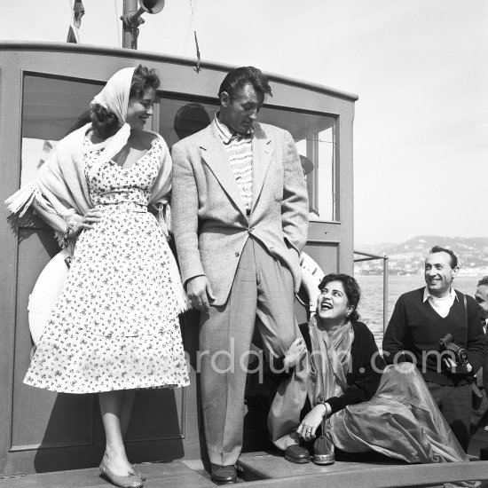 Robert Mitchum with French actress Lise Bourdin and an Indian actress. Cannes 1954. - Photo by Edward Quinn