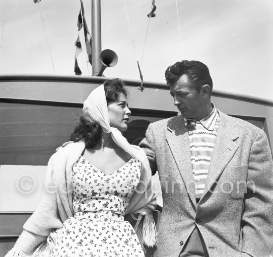 Robert Mitchum with French actress Lise Bourdin. Cannes 1954. - Photo by Edward Quinn