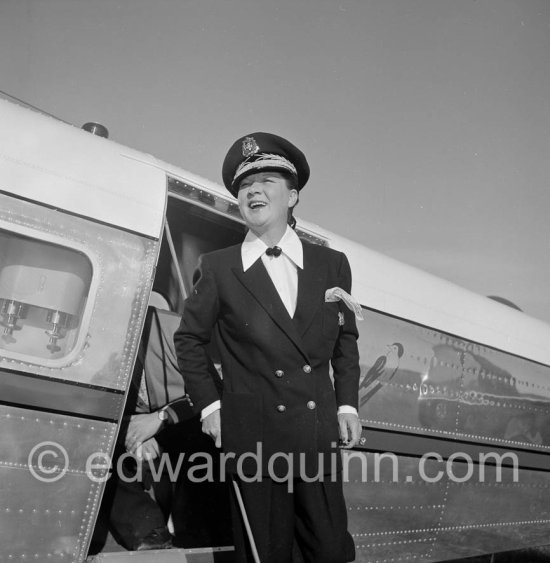 La Môme Moineau (the kid sparrow), "the richest woman of the Côte d\'Azur", former flower seller married to husband Mr. Benítez-Rexach, Dominican ship building millionaire. With one of her husbands gifts, a Beech 18 (85’000’000 francs). Cannes Airport 1954. - Photo by Edward Quinn