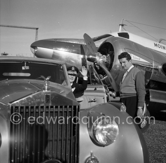 La Môme Moineau (the kid sparrow), "the richest woman of the Côte d\'Azur", former flower seller, married to Mr. Benítez-Rexach, Dominican ship building millionaire. On right the pilot. With one of her husbands gifts, a 1948 Rolls-Royce Silver Wraith, #LWAB63, 1950 Drophead Coupé Franay. Cannes Airport 1954. - Photo by Edward Quinn