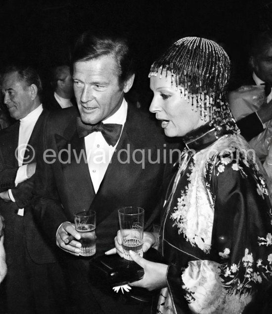 Roger Moore and his wife Luisa Mattioli. Wedding Party of Curd Jürgens and Margie, La Vieille Bastide, Saint-Paul-de-Vence 1978 - Photo by Edward Quinn