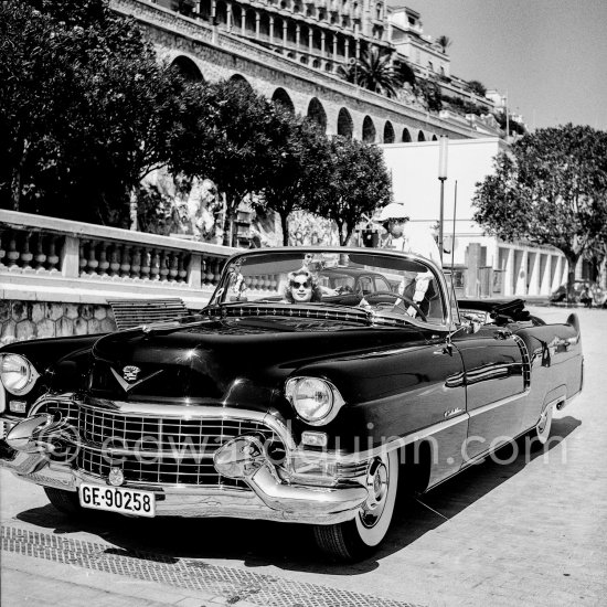 Narriman Sadek, ex Queen of Egypt. Farouk\'s second wife, was chosen from the ranks of Egypt\'s non-royal upper middle class as a populist gesture. Newspapers dubbed her the "Cinderella of the Nile". Monte Carlo 1955. Car: Cadillac 1955 Series 62 convertible Style 6267X - Photo by Edward Quinn