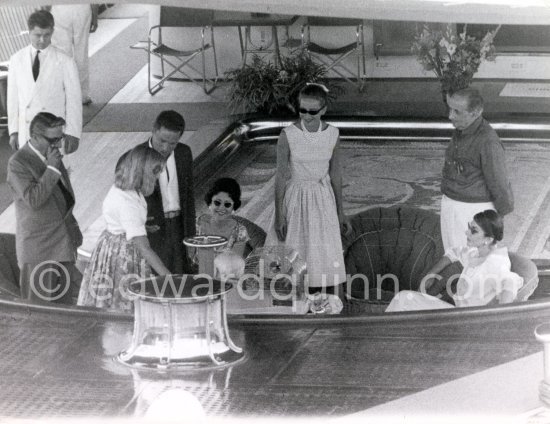 Aristotle Onassis, Tina Onassis, Maria Callas and her husband Giovanni Battista Meneghini. Sir Winston Churchill in front of the cage of Churchill's parrot Toby. On board Onassis' yacht Christina for Mediterranean cruise, Monaco harbor 1959. - Photo by Edward Quinn