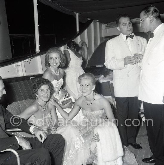 Tina Onassis and her sister Eugenie Niarchos, Cocktail on Onassis\' yacht Christina. Monaco harbor 1957. - Photo by Edward Quinn