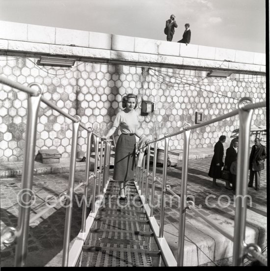 Tina Onassis getting on board the yacht Christina. Monaco harbor 1956. - Photo by Edward Quinn