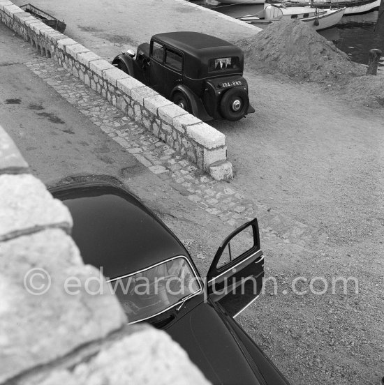 1955 or 56 Peugeot 403 limousine and Peugeot 201 or 301 (prewar) in the background. Beaulieu 1958. - Photo by Edward Quinn