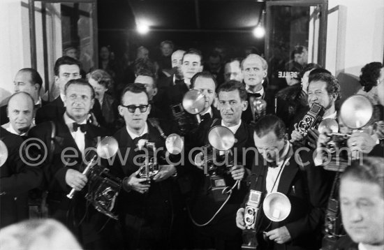 A group of photographers ready to shoot at the Cannes Film Festival. Cannes 1955. - Photo by Edward Quinn