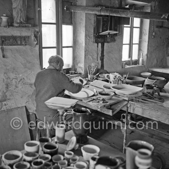 Pablo Picasso works on "Le picador" at the Madoura pottery. Vallauris 23.3.1953. - Photo by Edward Quinn