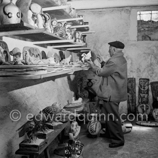 Pablo Picasso at storerooms at Madoura pottery where he keeps the originals. Vallauris 1953. - Photo by Edward Quinn