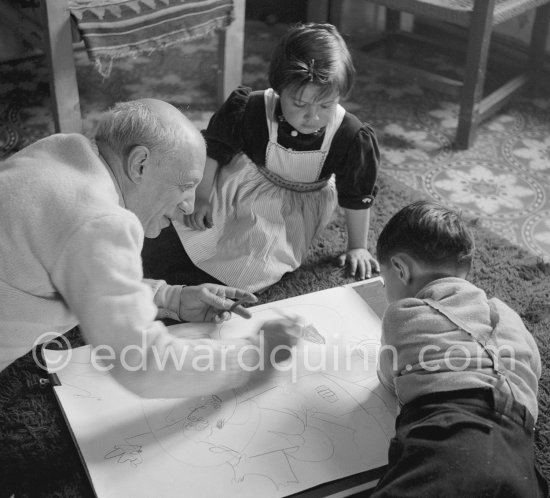 Drawing lesson given by Pablo Picasso to his children Claude Picasso and Paloma Picasso. La Galloise, Vallauris 16.4.1953. - Photo by Edward Quinn