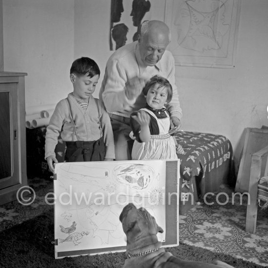 Drawing lesson given by Pablo Picasso to his children Claude Picasso and Paloma Picasso with boxer dog Jan. La Galloise, Vallauris 16.4.1953. - Photo by Edward Quinn