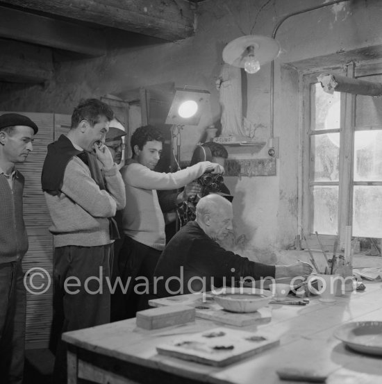 Pablo Picasso at Madoura pottery during filming of "Pablo Picasso", left director Luciano Emmer. Vallauris 15.10.1953. - Photo by Edward Quinn