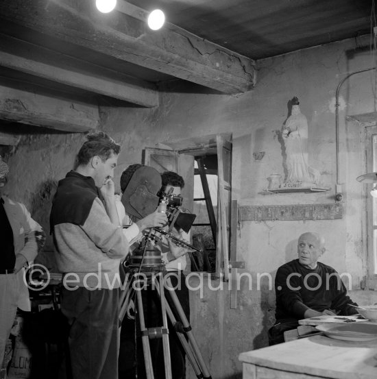 During filming of "Pablo Picasso", directed by Luciano Emmer. With a statue of St-Claude Picasso, the patron saint of the potters, whose name was given to his younger son. Madoura pottery, Vallauris 14.10.1953. - Photo by Edward Quinn